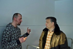 Prime Minister Viktor Orbán chats with resident during visit to homeless shelter in Budapest in February 2012. 