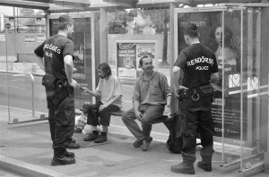 Police conduct identity check on homeless men in the 11th district of Budapest. 