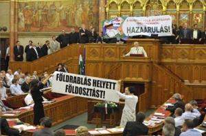 Jobbik and Politics Can Be Different representatives protest the new Land Law. 