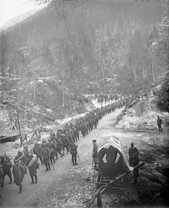 Italian troops advance through a mountain pass during the Battle of Vittorio Veneto. 