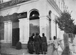 Sarajevans read notification of Austria-Hungary's annexation of Bosnia and Herzegovina posted at Moritz Schiller's delicatessen. Gavrilo Princip would assassinate Archduke Franz Ferdinand from this location six years later. 