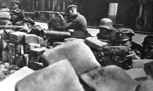 Hungarian Red Army soldiers fire at Ludovika Academy monitors bombarding the Socialist Party of Hungary headquarters in Budapest from the Danube River on June 24, 1919.