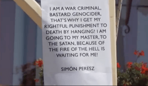 Sign on the gallows used to hang the effigy of Shimon Peres. 